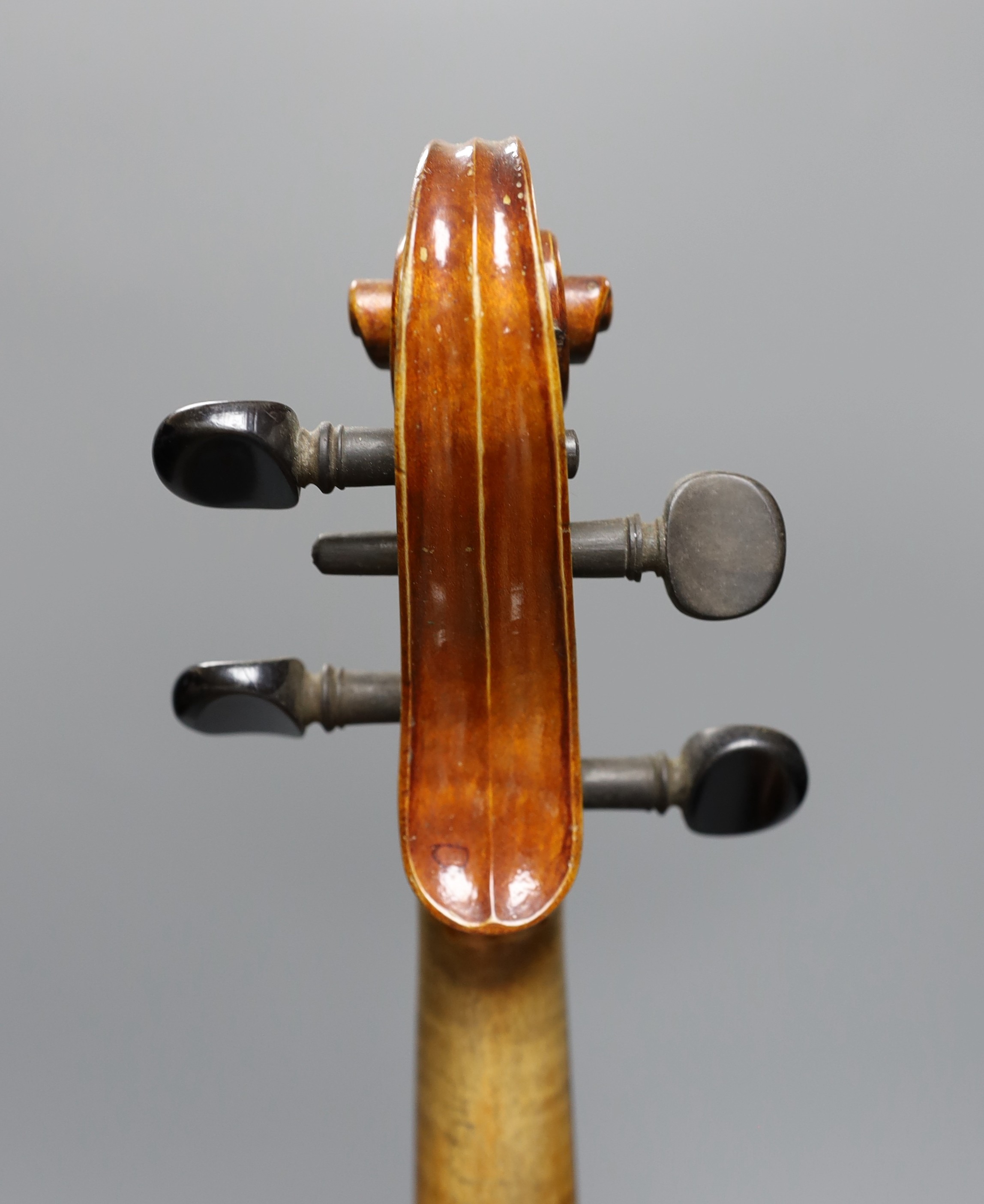 No labe and it is a full sized one.An early 20th century cased violin, length of back 36 cm